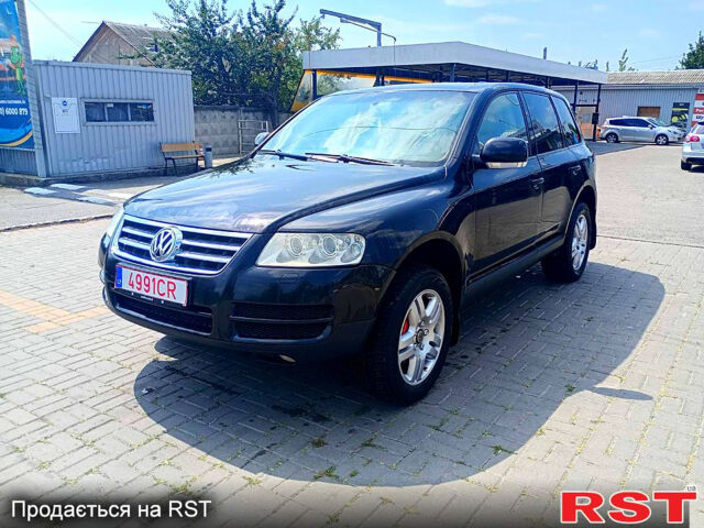 Черный Фольксваген Туарег, объемом двигателя 3.2 л и пробегом 318 тыс. км за 4950 $, фото 1 на Automoto.ua