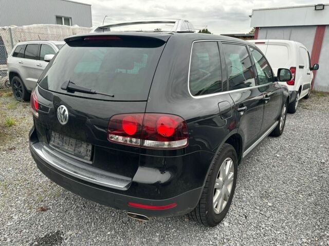 Черный Фольксваген Туарег, объемом двигателя 3 л и пробегом 312 тыс. км за 7300 $, фото 1 на Automoto.ua