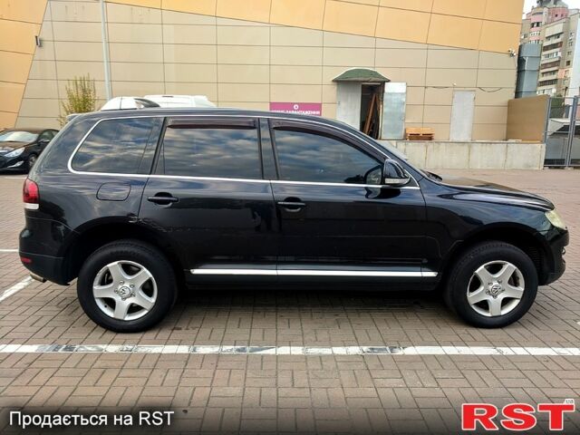 Чорний Фольксваген Туарег, об'ємом двигуна 3 л та пробігом 198 тис. км за 11300 $, фото 5 на Automoto.ua