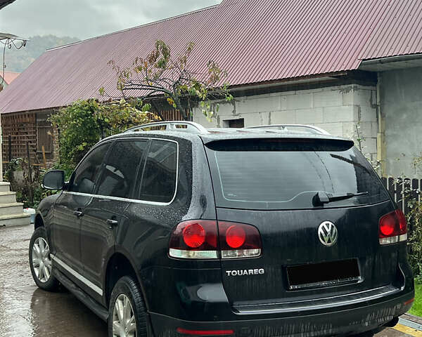 Черный Фольксваген Туарег, объемом двигателя 2.97 л и пробегом 305 тыс. км за 10800 $, фото 1 на Automoto.ua