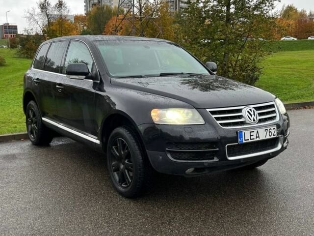 Черный Фольксваген Туарег, объемом двигателя 3 л и пробегом 280 тыс. км за 4900 $, фото 1 на Automoto.ua