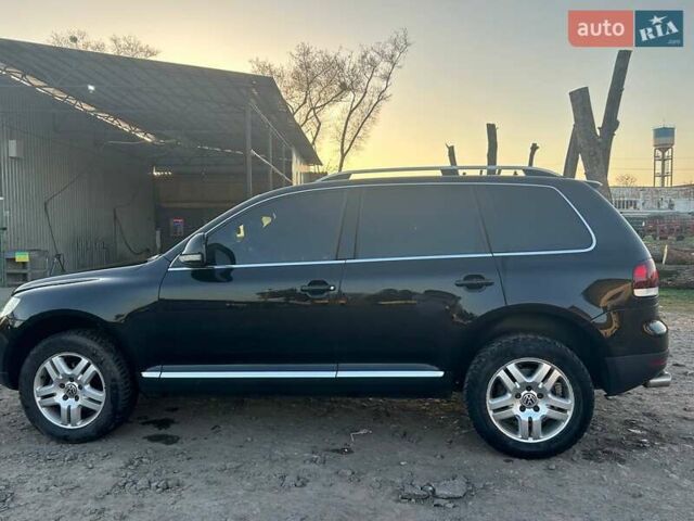 Чорний Фольксваген Туарег, об'ємом двигуна 3 л та пробігом 283 тис. км за 12200 $, фото 2 на Automoto.ua