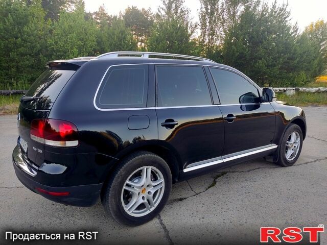 Чорний Фольксваген Туарег, об'ємом двигуна 3 л та пробігом 297 тис. км за 11777 $, фото 1 на Automoto.ua