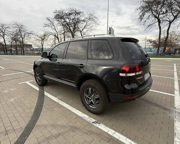 Черный Фольксваген Туарег, объемом двигателя 2.97 л и пробегом 263 тыс. км за 12500 $, фото 1 на Automoto.ua