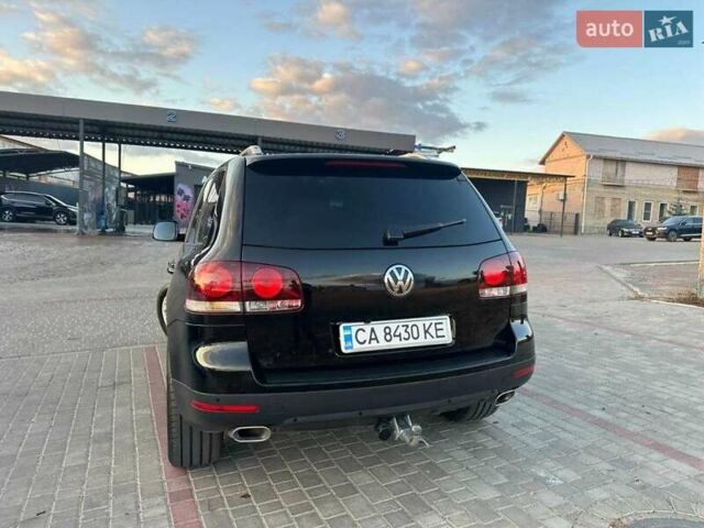 Черный Фольксваген Туарег, объемом двигателя 3 л и пробегом 198 тыс. км за 13086 $, фото 1 на Automoto.ua