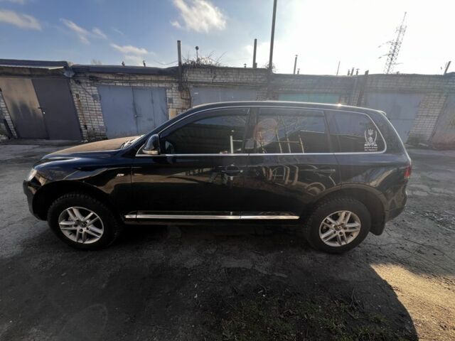 Чорний Фольксваген Туарег, об'ємом двигуна 3 л та пробігом 335 тис. км за 8499 $, фото 6 на Automoto.ua