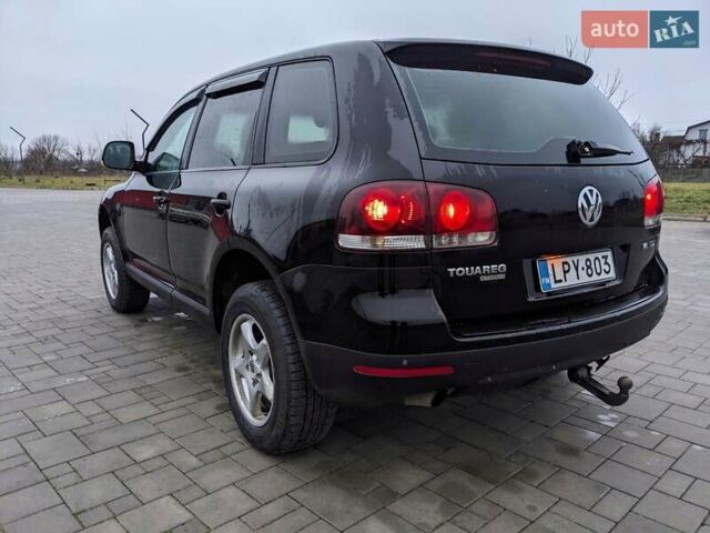 Черный Фольксваген Туарег, объемом двигателя 3 л и пробегом 305 тыс. км за 5850 $, фото 2 на Automoto.ua