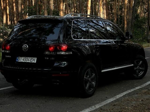 Черный Фольксваген Туарег, объемом двигателя 3 л и пробегом 300 тыс. км за 11000 $, фото 2 на Automoto.ua