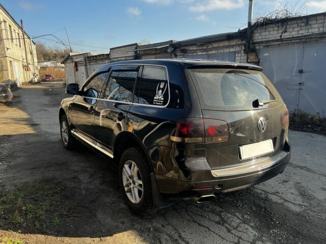 Чорний Фольксваген Туарег, об'ємом двигуна 3 л та пробігом 335 тис. км за 8499 $, фото 5 на Automoto.ua