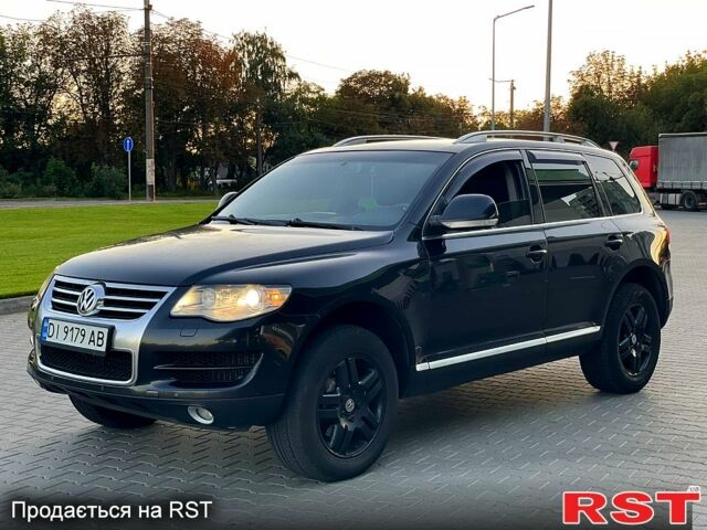 Черный Фольксваген Туарег, объемом двигателя 3 л и пробегом 258 тыс. км за 10800 $, фото 1 на Automoto.ua