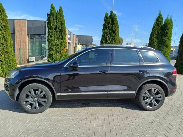 Черный Фольксваген Туарег, объемом двигателя 3 л и пробегом 240 тыс. км за 17500 $, фото 1 на Automoto.ua