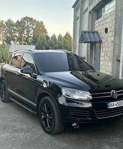 Черный Фольксваген Туарег, объемом двигателя 3 л и пробегом 294 тыс. км за 18500 $, фото 1 на Automoto.ua