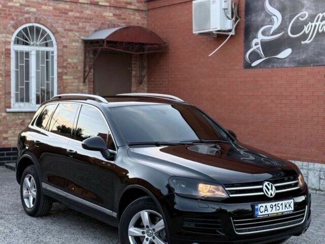 Чорний Фольксваген Туарег, об'ємом двигуна 3 л та пробігом 310 тис. км за 15500 $, фото 1 на Automoto.ua