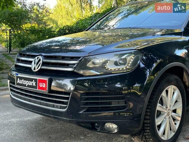Чорний Фольксваген Туарег, об'ємом двигуна 4.2 л та пробігом 255 тис. км за 28440 $, фото 1 на Automoto.ua