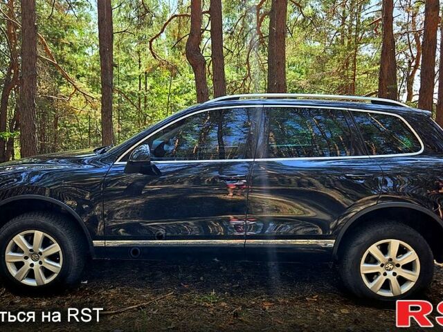 Черный Фольксваген Туарег, объемом двигателя 3 л и пробегом 350 тыс. км за 18500 $, фото 1 на Automoto.ua