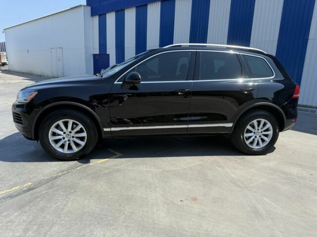 Черный Фольксваген Туарег, объемом двигателя 3 л и пробегом 315 тыс. км за 14850 $, фото 1 на Automoto.ua