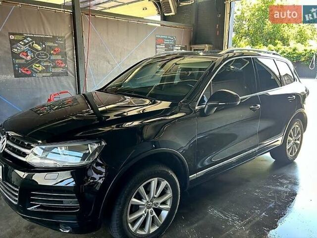 Чорний Фольксваген Туарег, об'ємом двигуна 3 л та пробігом 242 тис. км за 18750 $, фото 1 на Automoto.ua