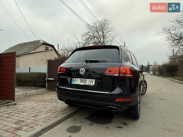 Чорний Фольксваген Туарег, об'ємом двигуна 4.13 л та пробігом 258 тис. км за 28500 $, фото 2 на Automoto.ua