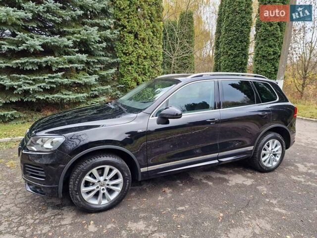 Черный Фольксваген Туарег, объемом двигателя 3 л и пробегом 209 тыс. км за 24999 $, фото 2 на Automoto.ua