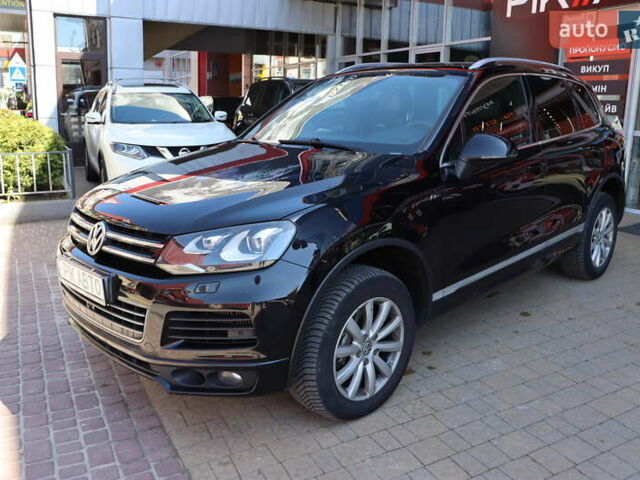 Черный Фольксваген Туарег, объемом двигателя 3 л и пробегом 142 тыс. км за 22900 $, фото 1 на Automoto.ua