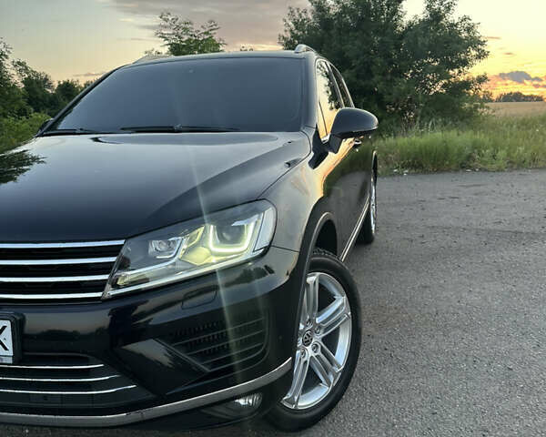 Черный Фольксваген Туарег, объемом двигателя 3 л и пробегом 262 тыс. км за 32500 $, фото 1 на Automoto.ua