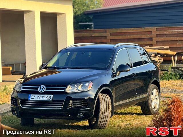 Черный Фольксваген Туарег, объемом двигателя 3 л и пробегом 184 тыс. км за 21800 $, фото 1 на Automoto.ua