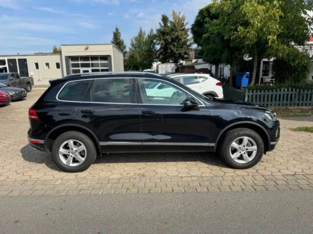 Чорний Фольксваген Туарег, об'ємом двигуна 3 л та пробігом 74 тис. км за 7000 $, фото 7 на Automoto.ua