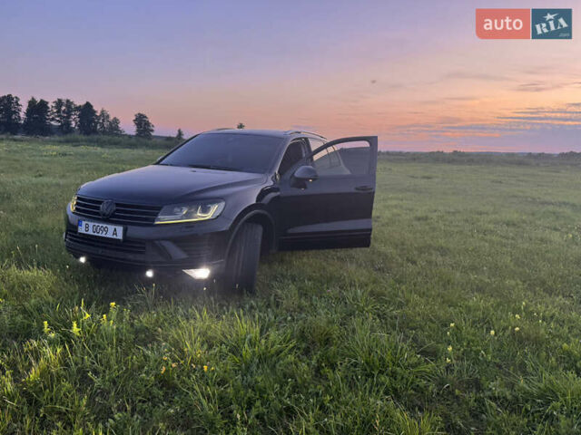 Черный Фольксваген Туарег, объемом двигателя 3 л и пробегом 230 тыс. км за 26000 $, фото 2 на Automoto.ua
