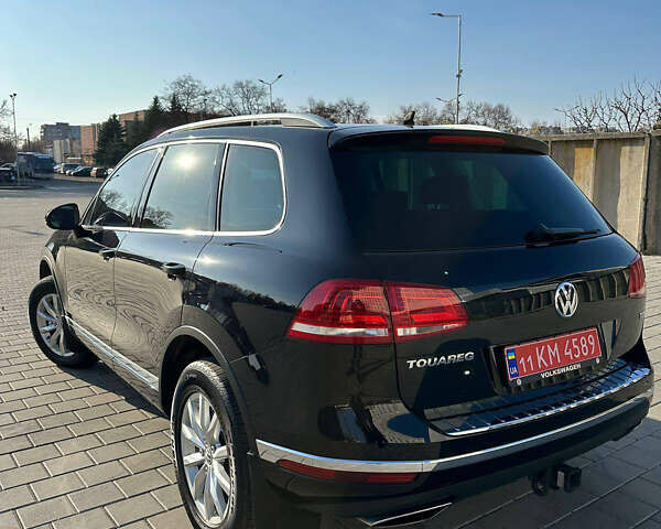 Черный Фольксваген Туарег, объемом двигателя 3 л и пробегом 235 тыс. км за 21500 $, фото 1 на Automoto.ua