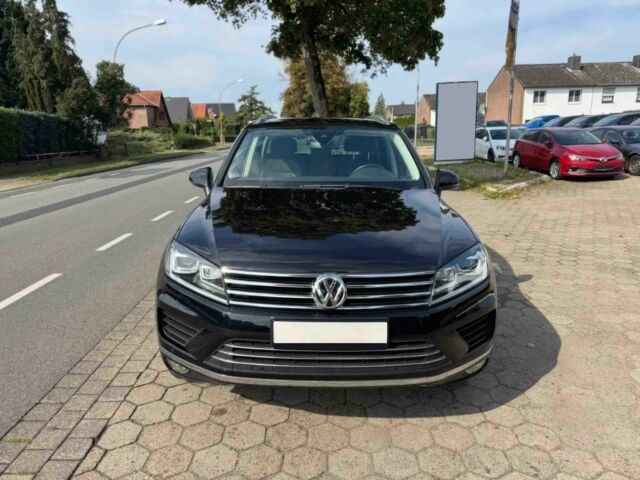 Чорний Фольксваген Туарег, об'ємом двигуна 3 л та пробігом 74 тис. км за 7000 $, фото 1 на Automoto.ua