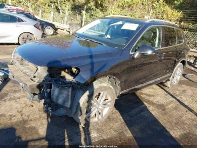 Черный Фольксваген Туарег, объемом двигателя 3 л и пробегом 170 тыс. км за 3000 $, фото 1 на Automoto.ua