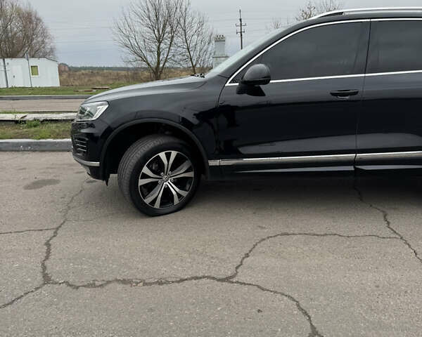 Черный Фольксваген Туарег, объемом двигателя 3 л и пробегом 249 тыс. км за 29900 $, фото 1 на Automoto.ua