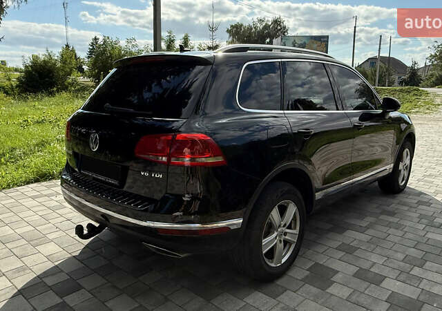 Черный Фольксваген Туарег, объемом двигателя 3 л и пробегом 210 тыс. км за 25000 $, фото 4 на Automoto.ua