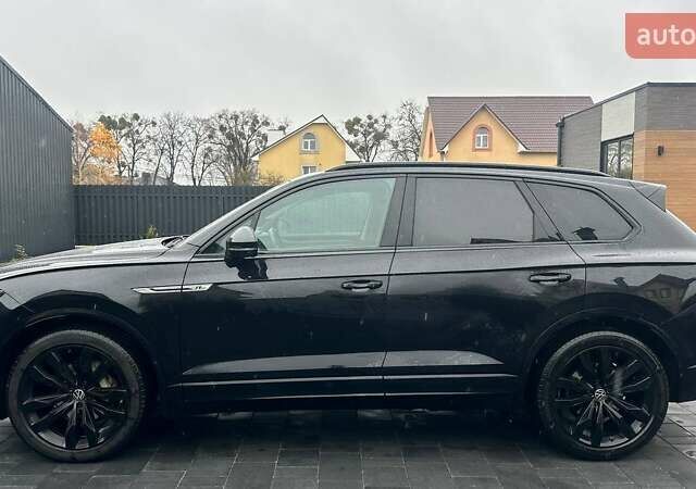Чорний Фольксваген Туарег, об'ємом двигуна 3 л та пробігом 145 тис. км за 49990 $, фото 1 на Automoto.ua