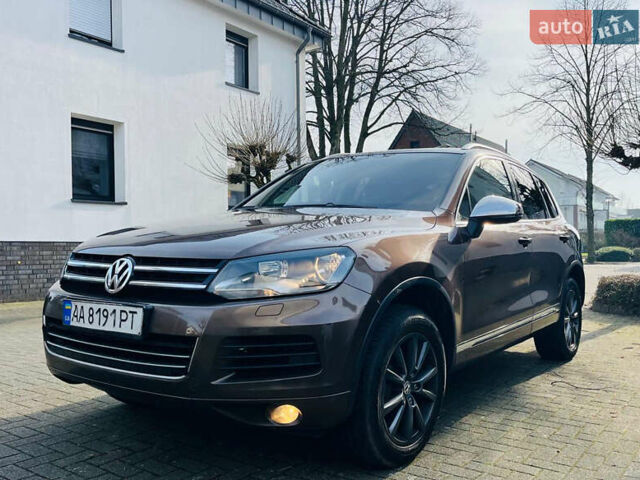 Коричневый Фольксваген Туарег, объемом двигателя 3 л и пробегом 175 тыс. км за 19000 $, фото 1 на Automoto.ua