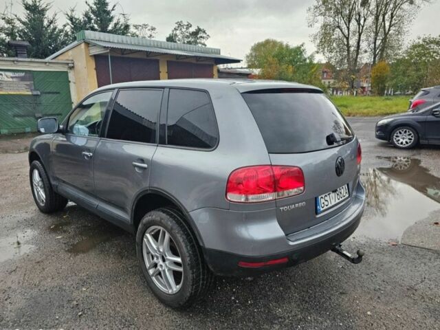 Серый Фольксваген Туарег, объемом двигателя 2.5 л и пробегом 296 тыс. км за 2600 $, фото 2 на Automoto.ua