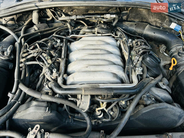 Серый Фольксваген Туарег, объемом двигателя 4.2 л и пробегом 310 тыс. км за 7400 $, фото 7 на Automoto.ua