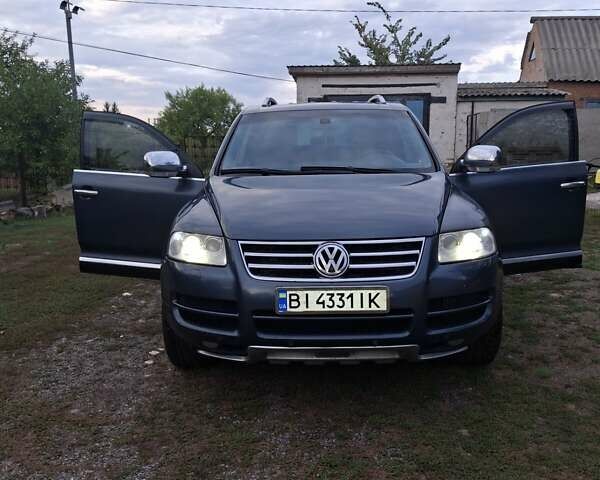 Серый Фольксваген Туарег, объемом двигателя 2.97 л и пробегом 380 тыс. км за 9200 $, фото 1 на Automoto.ua