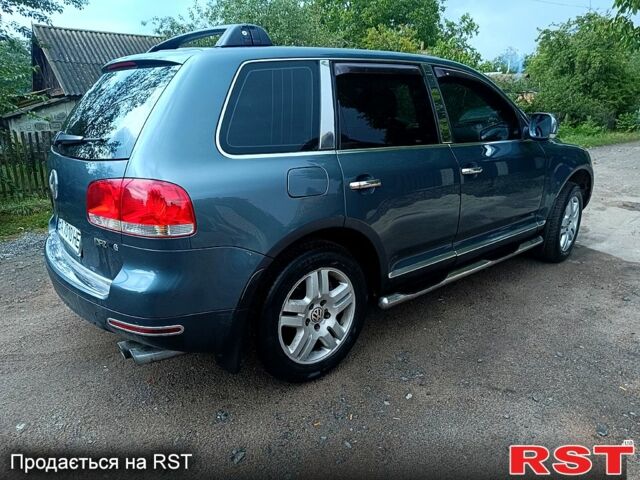 Серый Фольксваген Туарег, объемом двигателя 3.2 л и пробегом 300 тыс. км за 8500 $, фото 1 на Automoto.ua