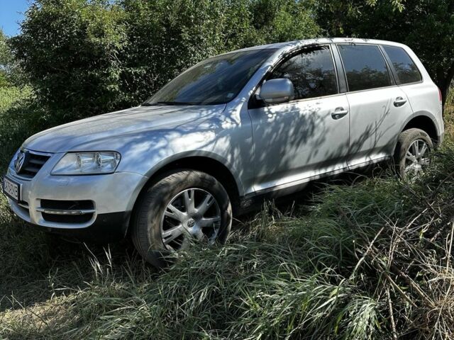 Серый Фольксваген Туарег, объемом двигателя 3 л и пробегом 290 тыс. км за 5800 $, фото 1 на Automoto.ua