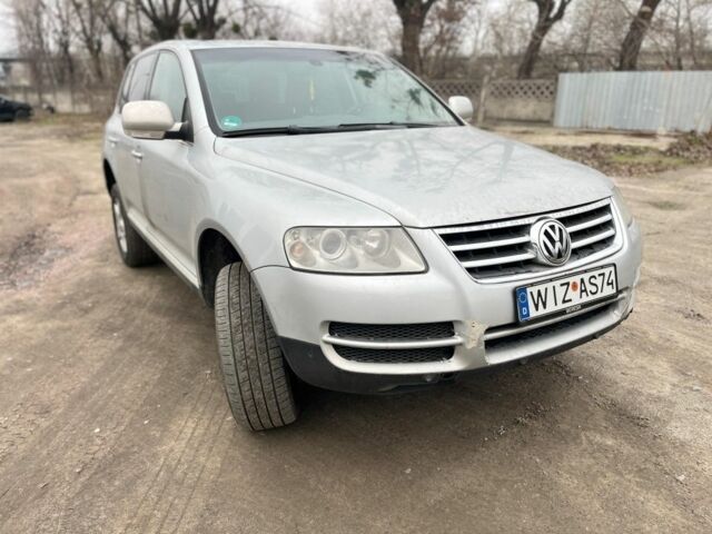 Серый Фольксваген Туарег, объемом двигателя 3 л и пробегом 340 тыс. км за 5500 $, фото 1 на Automoto.ua