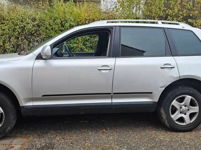 Сірий Фольксваген Туарег, об'ємом двигуна 3 л та пробігом 302 тис. км за 6402 $, фото 1 на Automoto.ua