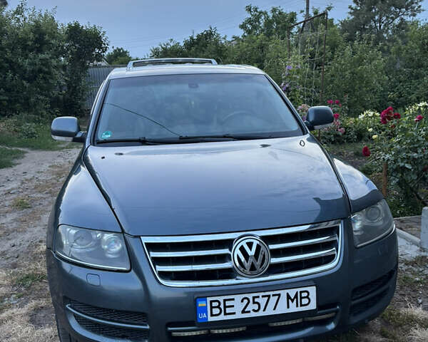 Серый Фольксваген Туарег, объемом двигателя 3 л и пробегом 406 тыс. км за 11500 $, фото 4 на Automoto.ua