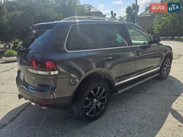 Серый Фольксваген Туарег, объемом двигателя 3 л и пробегом 187 тыс. км за 15500 $, фото 3 на Automoto.ua