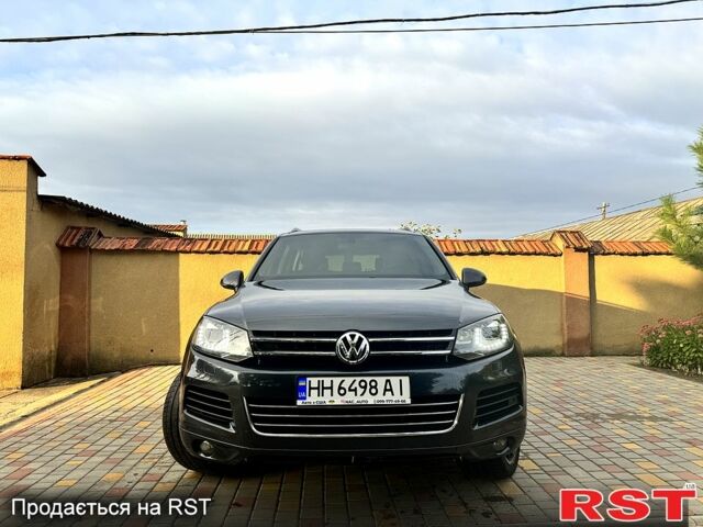 Серый Фольксваген Туарег, объемом двигателя 3 л и пробегом 130 тыс. км за 18000 $, фото 1 на Automoto.ua