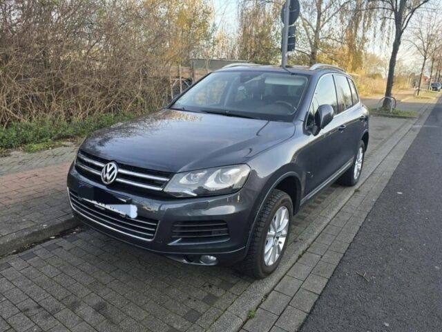 Серый Фольксваген Туарег, объемом двигателя 3 л и пробегом 238 тыс. км за 2248 $, фото 1 на Automoto.ua