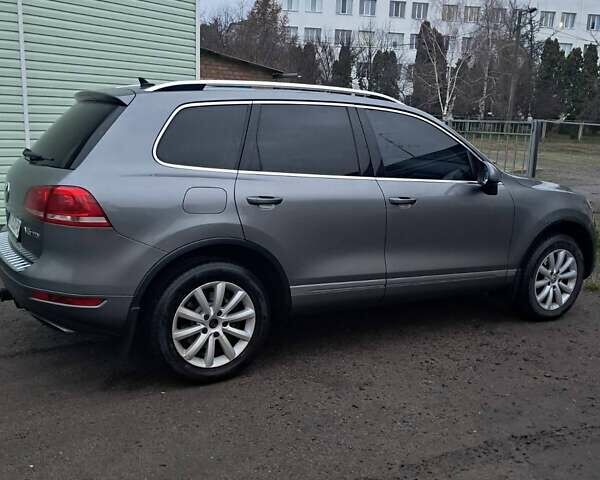 Серый Фольксваген Туарег, объемом двигателя 3 л и пробегом 267 тыс. км за 17500 $, фото 1 на Automoto.ua