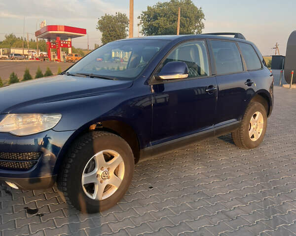 Синий Фольксваген Туарег, объемом двигателя 3 л и пробегом 235 тыс. км за 11100 $, фото 1 на Automoto.ua