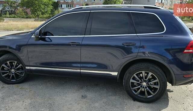 Синий Фольксваген Туарег, объемом двигателя 3 л и пробегом 214 тыс. км за 17900 $, фото 5 на Automoto.ua