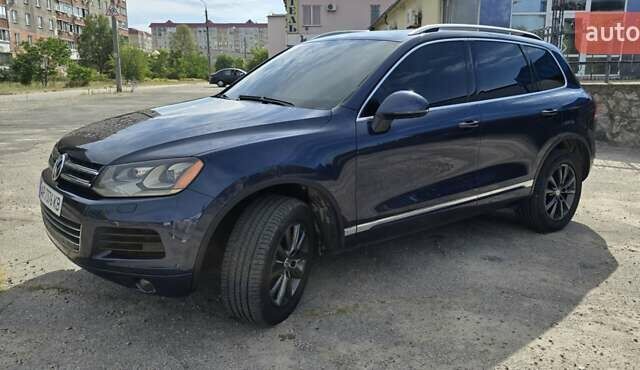 Синий Фольксваген Туарег, объемом двигателя 3 л и пробегом 214 тыс. км за 17900 $, фото 1 на Automoto.ua